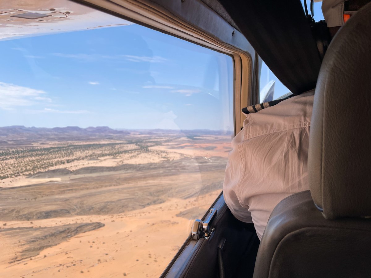 Pilot in a Cessna bush plane taking off from a remote airstrip
